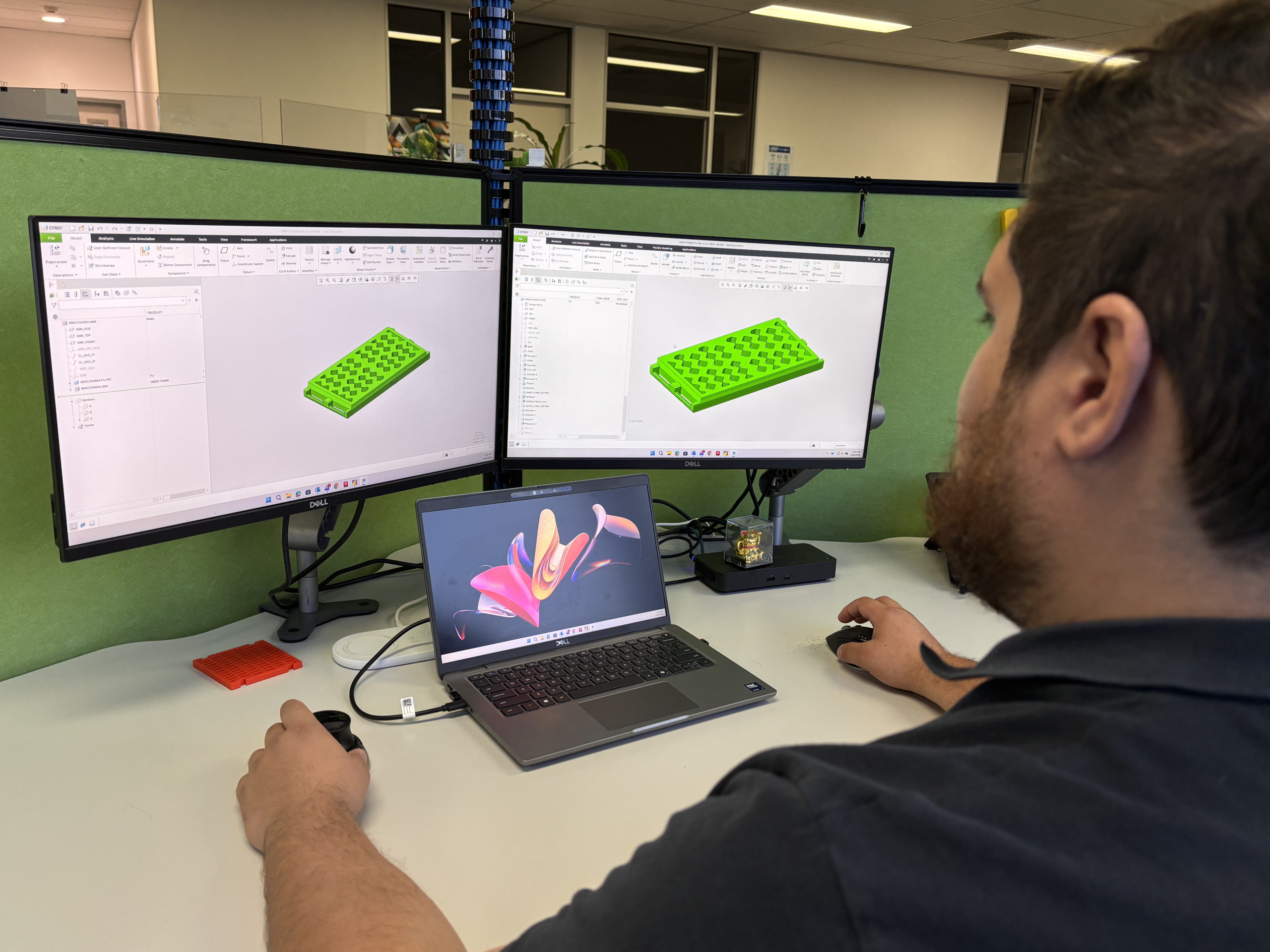 A Multotec employee uses a computer to implement a screening process